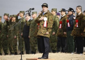 Japan's Defence Minister Onodera reviews troops from the Japanese Ground Self-Defense Force 1st Airborne Brigade during an annual new year military exercise in Funabashi