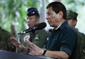 Philippine President Rodrigo Duterte speaks to soldiers during a visit at a military camp in Iligan