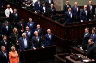 Poland's lawmakers stand to honour memory of Poles killed in the war in Ukraine during the speech by the chairman of the Ukrainian parliament, Ruslan Stefanchuk, in Poland's parliament, in Warsaw, Poland, on Thursday, 25 May 2023. (AP Photo/Czarek Sokolowski)