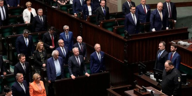 Poland's lawmakers stand to honour memory of Poles killed in the war in Ukraine during the speech by the chairman of the Ukrainian parliament, Ruslan Stefanchuk, in Poland's parliament, in Warsaw, Poland, on Thursday, 25 May 2023. (AP Photo/Czarek Sokolowski)