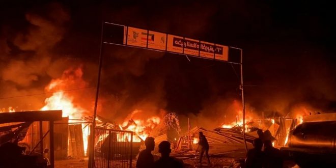 Fire rages following an Israeli strike in an area designated for displaced Palestinians in Rafah on May 26, 2024. Reuters TV/Reuters